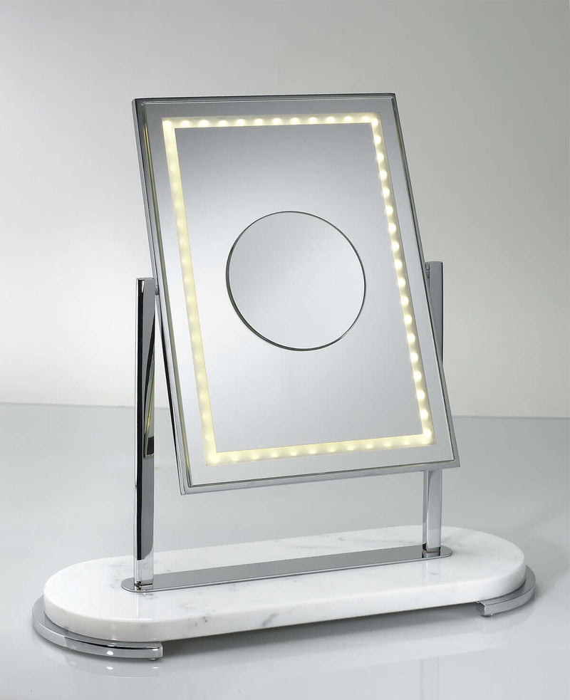 Mon Beau with 3x inset makeup mirror tilts up and down and flips over to a plain lighted side without an inset magnification mirror.