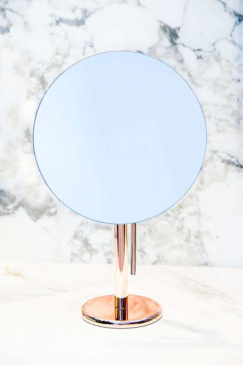 The Miroir Brot Epure in Polished Copper showing its 9&quot; mirror, backed with pure silver for a beautiful, bright image.