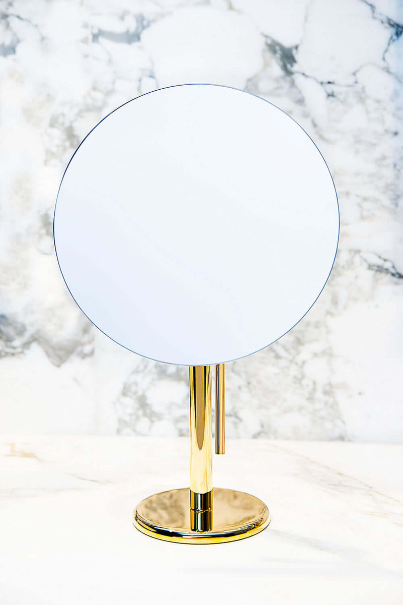 A Polished Gold (D1) Epure makeup mirror with large 9&quot; rimless mirror is a beautiful, eye-popping feature in your bathroom.