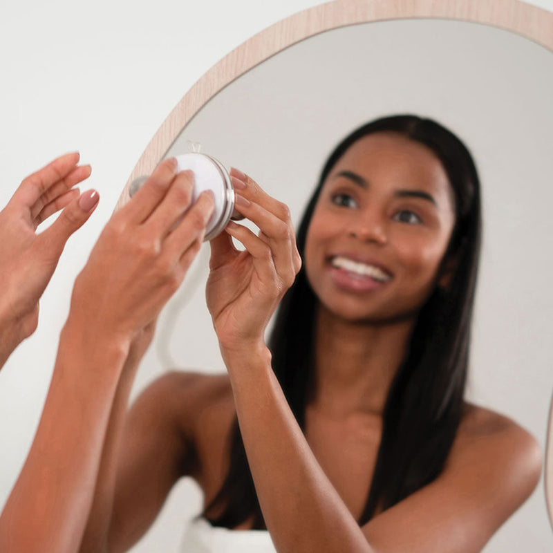 Position the rechargeable makeup mirror to the best location using the suction cup accessory mount.