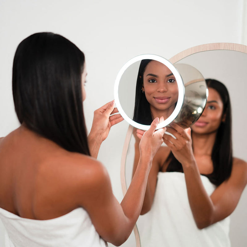 Position the rechargeable makeup mirror to the best location using the suction cup accessory mount.